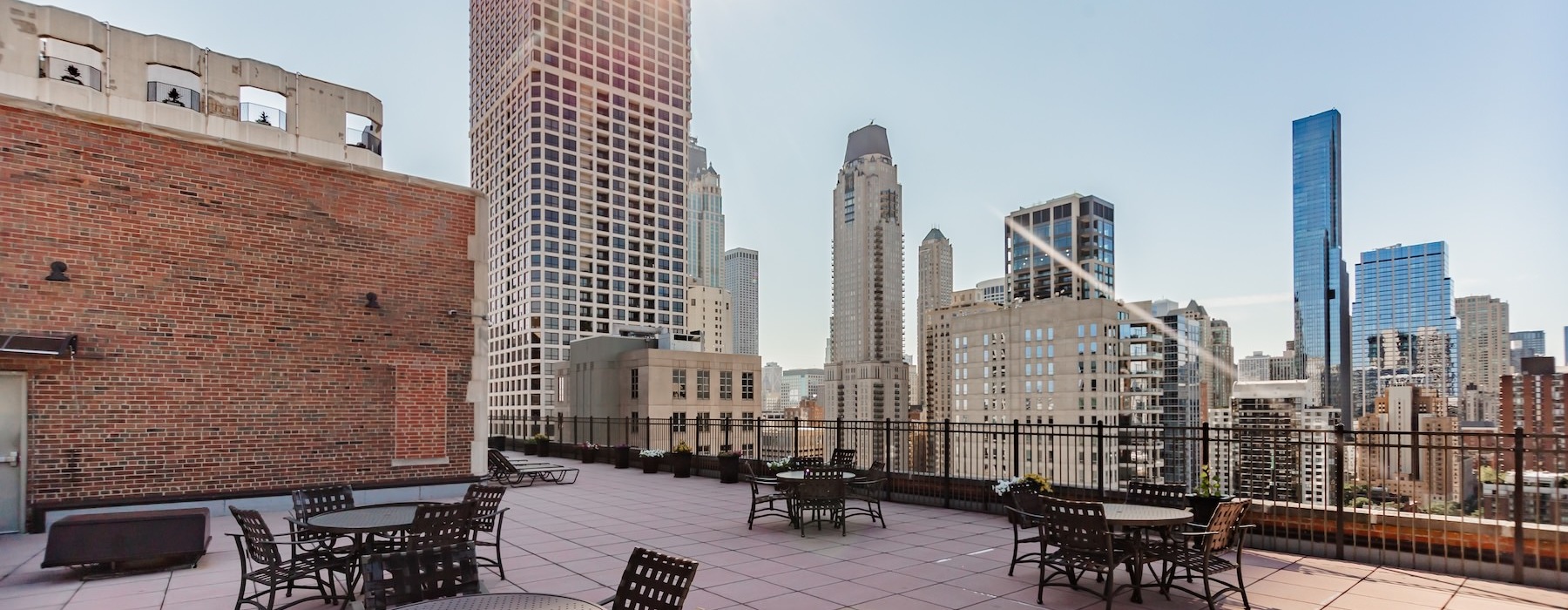 a rooftop with a view of the city