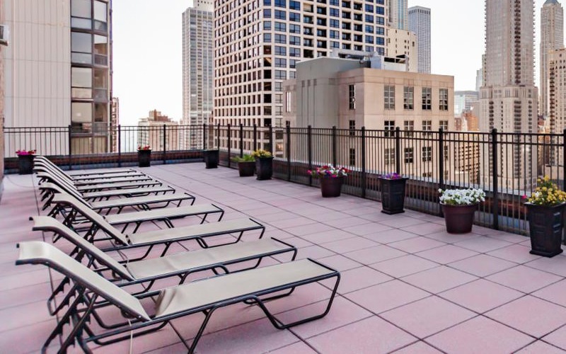 a city skyline with a brick walkway